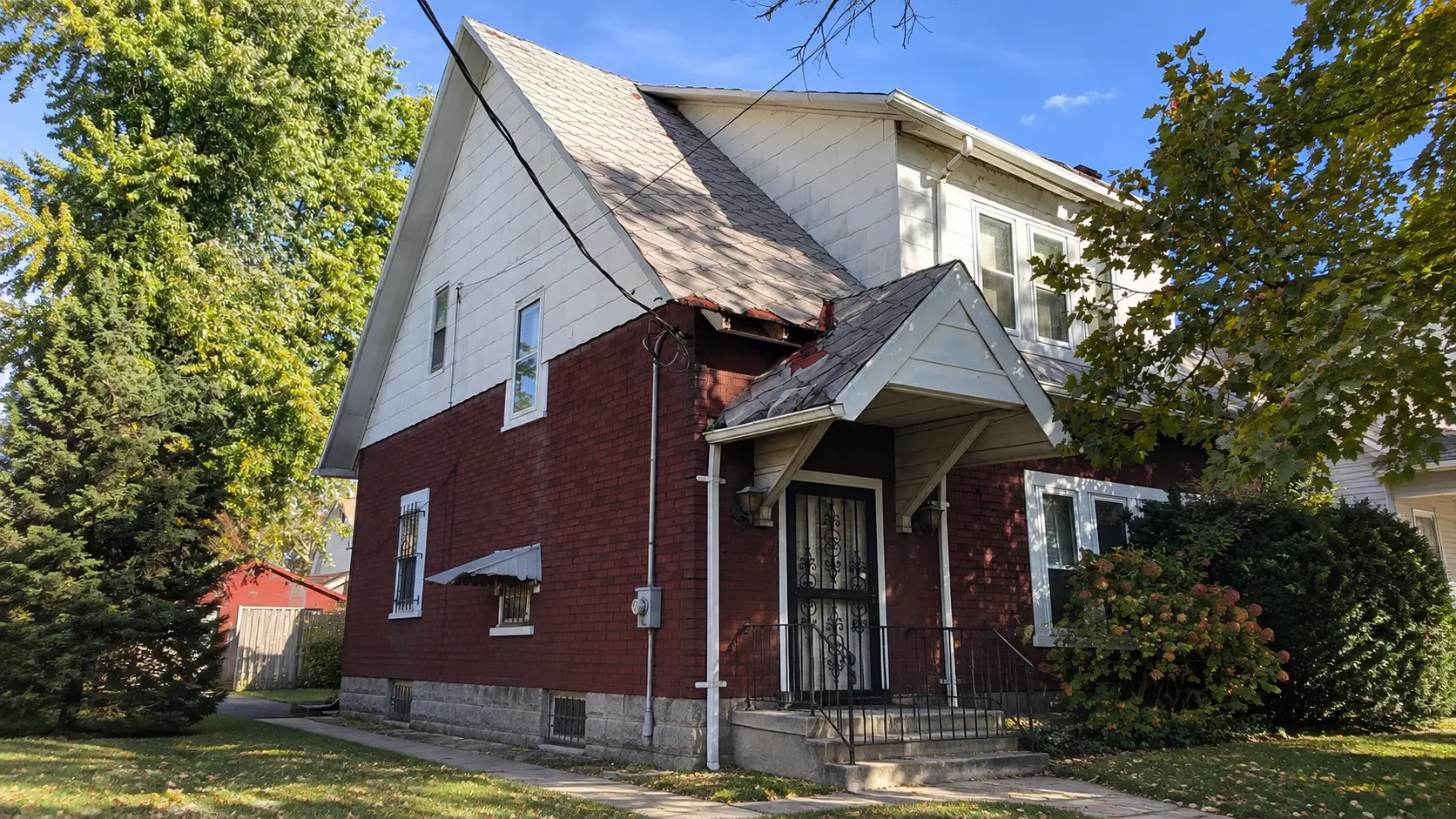 Siding & Roof Makeover before